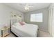 Bedroom featuring a queen size bed, neutral walls and light streaming in from the window at 18082 Eau Gallie S Cir, Port Charlotte, FL 33948