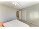 Bedroom with queen bed leading to a bathroom with a full tub/shower at 18082 Eau Gallie S Cir, Port Charlotte, FL 33948