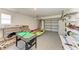 Spacious garage area complete with foosball table, ping pong table, kayaks, and shelving at 18082 Eau Gallie S Cir, Port Charlotte, FL 33948