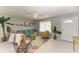 Comfortable living room with tile flooring, a ceiling fan, and inviting decor at 18082 Eau Gallie S Cir, Port Charlotte, FL 33948