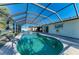 A long view of the enclosed pool and the waterfront location at 18082 Eau Gallie S Cir, Port Charlotte, FL 33948