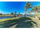 Waterfront property with lush, tropical landscaping and a private boat dock at 18082 Eau Gallie S Cir, Port Charlotte, FL 33948