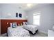 Nautical bedroom with two beds, nautical pillows and throws, and wainscoting feature wall at 212 Spring Ave, Anna Maria, FL 34216