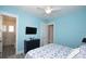 Bright bedroom with nautical themed decor, a television, and a nautical quilt at 212 Spring Ave, Anna Maria, FL 34216