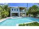 Beautiful two-story home with a private pool, putting green, and outdoor entertainment area at 212 Spring Ave, Anna Maria, FL 34216