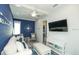Cozy living room with nautical decor, comfortable seating, and a flat-screen TV, perfect for relaxation at 212 Spring Ave, Anna Maria, FL 34216