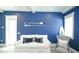 Living room with nautical-themed decor, white sofa, nautical accents, and lots of light at 212 Spring Ave, Anna Maria, FL 34216