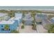 Expansive aerial view of a coastal home, offering a glimpse of the neighborhood and stunning beach nearby at 216 Tenacity Ln, Sarasota, FL 34242