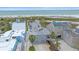 Aerial view of a coastal home near the beach, with modern design and convenient access to the ocean and beaches at 216 Tenacity Ln, Sarasota, FL 34242