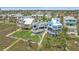 Aerial view of a coastal home in a scenic neighborhood, with palm trees and access to nearby amenities at 216 Tenacity Ln, Sarasota, FL 34242