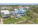 Drone shot of a home surrounded by lush landscaping, showcasing its beautiful location and neighborhood at 216 Tenacity Ln, Sarasota, FL 34242