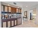 Modern bar area features sleek cabinetry, wine storage, and a mini-fridge, perfect for entertaining guests at 216 Tenacity Ln, Sarasota, FL 34242