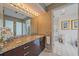 Beautiful bathroom featuring granite countertops, a walk-in shower, and white tile flooring at 216 Tenacity Ln, Sarasota, FL 34242