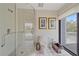 Bright bathroom featuring a glass shower and a convenient bidet for added comfort at 216 Tenacity Ln, Sarasota, FL 34242
