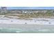 Stunning view of the beach with pristine white sand and clear turquoise water, near beautiful coastal homes at 216 Tenacity Ln, Sarasota, FL 34242