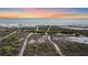 Picturesque beach scene with serene Gulf views and tranquil walking paths with beachfront home in the background at 216 Tenacity Ln, Sarasota, FL 34242
