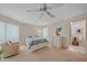 Bright bedroom features a comfortable bed, ample natural light, and a view into the ensuite bathroom at 216 Tenacity Ln, Sarasota, FL 34242