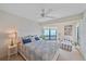 Bedroom featuring a comfortable bed, soft, natural light and seating area for relaxation at 216 Tenacity Ln, Sarasota, FL 34242