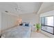 Bedroom features a comfortable bed, ample natural light and storage space at 216 Tenacity Ln, Sarasota, FL 34242