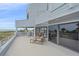 Outdoor deck offering stunning views of the beach and ocean waters with seating at 216 Tenacity Ln, Sarasota, FL 34242