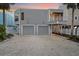 Charming beach house with a convenient two-car garage and ample driveway space at 216 Tenacity Ln, Sarasota, FL 34242
