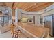 Open concept kitchen and living space include a breakfast bar and views, perfect for modern living at 216 Tenacity Ln, Sarasota, FL 34242
