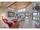 Bright living room with wooden ceilings, an ocean view, and comfortable seating that creates a welcoming atmosphere at 216 Tenacity Ln, Sarasota, FL 34242