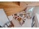Open-concept living room with high ceilings, a wooden ceiling, tile floors, and bright lighting at 216 Tenacity Ln, Sarasota, FL 34242
