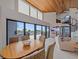 Bright, airy living area features ocean views, a dining table, wooden ceilings, and spiral staircase at 216 Tenacity Ln, Sarasota, FL 34242