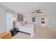 Spacious main bedroom with neutral tones, art, lamps, and ceiling fan at 216 Tenacity Ln, Sarasota, FL 34242