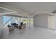 Spacious outdoor lounge with modern wicker furniture, providing a comfortable space for entertaining and relaxation at 216 Tenacity Ln, Sarasota, FL 34242