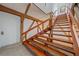 Elegant wooden staircase showcasing a modern design with ample natural light at 216 Tenacity Ln, Sarasota, FL 34242