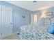 Blue bedroom with coastal decor and door to ensuite bath at 2165 Lemon Ave, Englewood, FL 34223