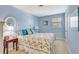 Light blue bedroom with coastal decor and a comfortable bed at 2165 Lemon Ave, Englewood, FL 34223