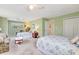 Spacious green bedroom with two beds and natural light at 2165 Lemon Ave, Englewood, FL 34223