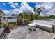 An outdoor wooden deck area features a white wooden bench and a fenced in area at 2165 Lemon Ave, Englewood, FL 34223
