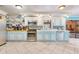 Well-equipped kitchen with ample counter space and stylish blue and white cabinetry at 2165 Lemon Ave, Englewood, FL 34223