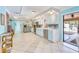 Open concept kitchen with stainless steel appliances and ample natural light at 2165 Lemon Ave, Englewood, FL 34223
