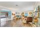 Spacious living room featuring hardwood floors and a seamless transition to the dining area at 2165 Lemon Ave, Englewood, FL 34223
