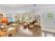 Cozy living room with ample natural light and stylish wicker furniture at 2165 Lemon Ave, Englewood, FL 34223