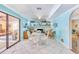 Inviting living space with a decorative fireplace and sliding door access to the patio at 2165 Lemon Ave, Englewood, FL 34223