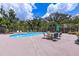 Backyard pool area with a nice outdoor dining set at 2165 Lemon Ave, Englewood, FL 34223