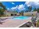 Large backyard featuring a swimming pool, patio space, and detached garage at 2165 Lemon Ave, Englewood, FL 34223