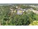 Aerial view of residential area with tree coverage and well-maintained single-Gathering homes at 2303 58Th E St, Palmetto, FL 34221