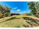 Sprawling backyard with lush green grass and wooden fence at 2303 58Th E St, Palmetto, FL 34221
