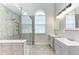 Modern bathroom with a glass-enclosed shower and double vanities at 2303 58Th E St, Palmetto, FL 34221