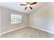 Comfortable bedroom with a ceiling fan and natural light from the window at 2303 58Th E St, Palmetto, FL 34221