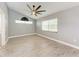 Bright, spacious bedroom with light gray walls and modern ceiling fan at 2303 58Th E St, Palmetto, FL 34221