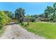 Lovely single-story home with a well-maintained lawn and mature trees at 2303 58Th E St, Palmetto, FL 34221