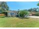 Charming single-story home with well-manicured lawn and lush landscaping at 2303 58Th E St, Palmetto, FL 34221